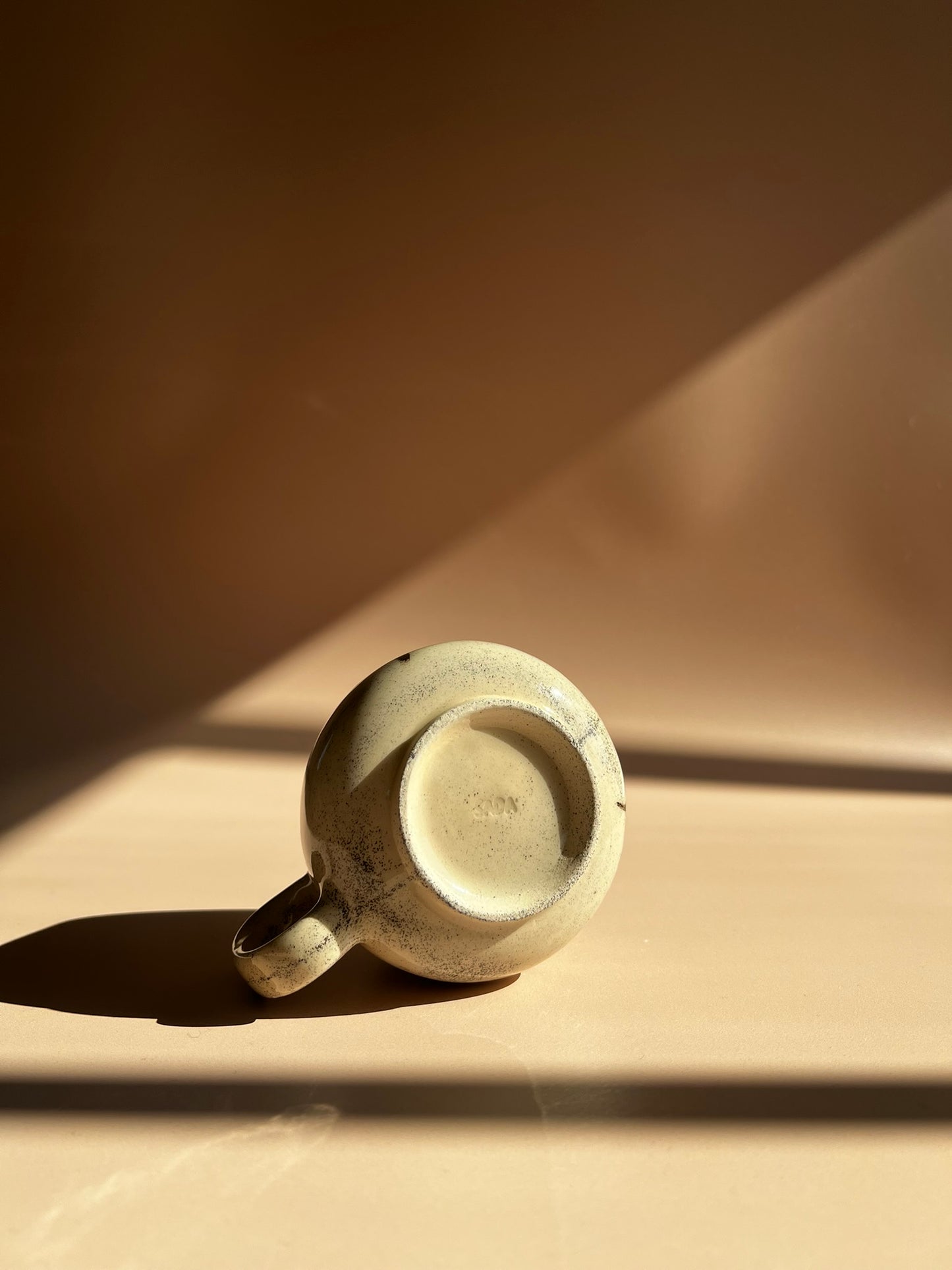 Noir Petal . Pebble Mug